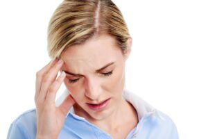 Young businesswoman has splitting headache pain migrain