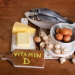 Foods containing vitamin D on a wooden background. View from above